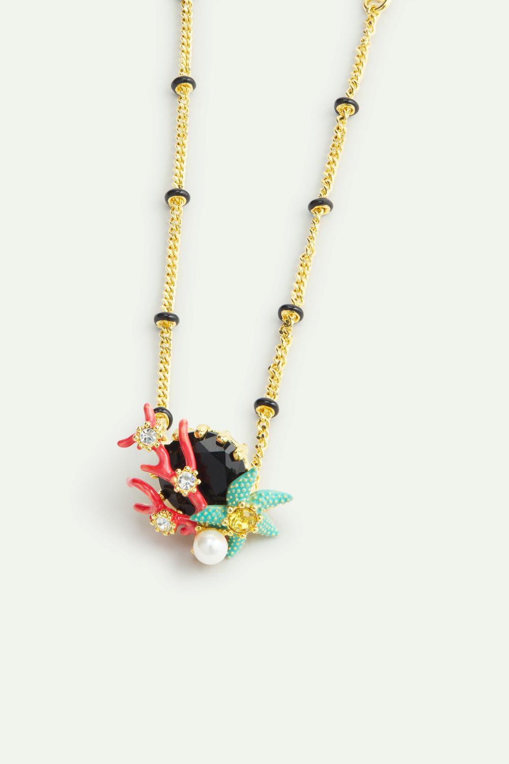 FINE BRACELET WITH RED CORAL AND BLUE STARFISH